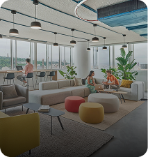 Bright conference room lounge on the 3rd floor with large windows and collaborative seating
